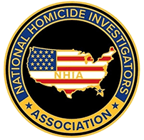 A gold and red american flag pin on the back of an nhia logo.