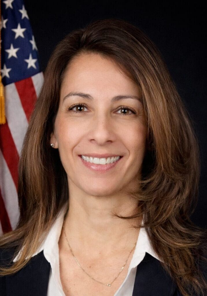 Brunette professional portrait with flag