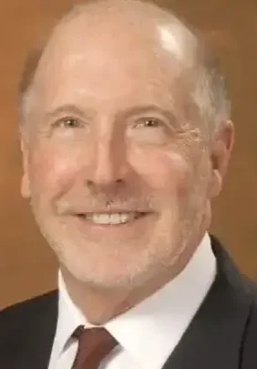 Portrait of smiling executive in dark jacket